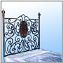 An orthodox; one of a kind tall head bed. Comprising of well defined and aptly engineered composition. Blend of heavy cast motifs and hot forged elements. A perfection in harmony; with fine brass work and an oval etched glass center piece for mass concentration. All tall head-boards beds available with equally ornate foot boards. Sizes: W : 6'  H : 6.5'  WT : 125 lbs (Bed Head)