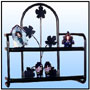 Utility Wall Mounted Rack  A living room wall mounted rack. Also suitable for areas where children's approach is not desirable complete with edged glass shelves Sizes: H : 24"  Rack size: 23.5" x 8"  WT : 11 lbs (Without Glass)  Frame in 3/4" Tubing.  Decorative Profiled Stamped Motifs in Heavy Sections.  3/8" Round Stock Elements.