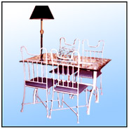 A dinning set for four from "Comforta" range. Softly contoured and monolithically constructed chairs. Available in two options:    1. Heavy wrought iron.        2. Lightweight circular tubing.  Tubular; aptly engineered table with edged 6/8 mm clear glass top. Chair    Sizes: B.H : 42"  S.H : 17"   S. Size : 16" x 15"  WT : 31 lbs    A blend of 1/2" Round Stock in basic frame work.  Motif & filling in 1/2" Premium Grade Round Tubing.    Chair brasses; Solid Stock 3/8" with matching forged reef knots.    Table     Sizes: H : 36.5"  Top Size : 40" x 30" WT : 20 lbs (Without Glass)    All Tubular; blend of non-circular 11/2" x 11/2" & Round of Tubing.   Top Bar in 11/2" x 2" non-circular Tubing.      