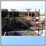 A building architecture richly complemented with ornate light alloy motif work.