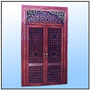 A selected piece out of the "Decor Classic" range of extra heavy; double sandwich house doors with frames. The panels inlays, generally moulded in light alloys in Geometric or floral motifs. Timber casing could be plain or wood in wood inlayed. This particular piece is crowned with a very rich fanlight and comparatively simple in lay.