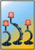 Non-Concentric Candle Stands     A range of classic molded candle stands in variable heights. Eccentric over-hangs is a specialty feature.    a) Sizes: H : 5.5"  W : 4"  WT : 1 lbs    b) Sizes: H : 10.50"  W : 4"  WT : 3 lbs    Profiled Moulded; Machined Base 3.75" dia    Heavy alloy Moulded; Profiled Motif.  Stamped Candle Plate (20 swg) 2.5" dia.      