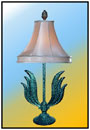 Corner Table Lamp   A heavy; orthodox antiqued piece for the discerning.   Sizes: H : 19"  W : 11"  WT : 5.5 lbs       Deep Profiled Bases 5.75" dia; alloy Casted.   Unusual heavy Twin face Motif Spread.   Mild Steel Stem 5/8" with Fittings.  
